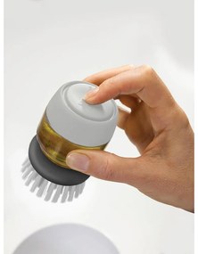 Sivá kefa s dávkovačom a stojanom Joseph Joseph Palm Scrub