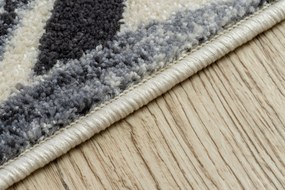 Koberec HEOS 78540  krémovo / modrý LISTY DŽUNGLE